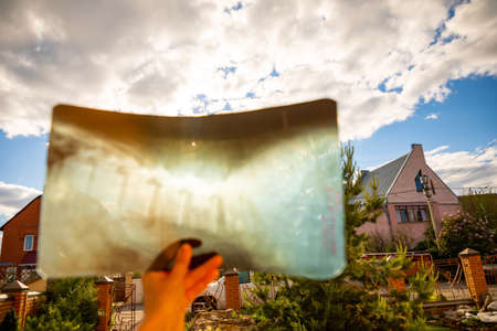 Watching solar eclipse through x-ray images in sunny dayの写真素材