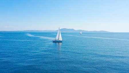 Aerial view of sailing luxury yacht at opened sea at sunny day in Croatia