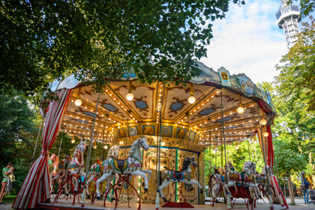 Prague, Czech Republic - 23.08.2021: Old Germany carousel in Petrin hill in summer time in Prague,...