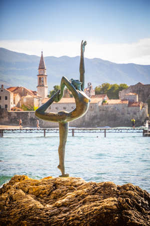 Budva, Montenegro - September 18, 2021: Statue of a dancer on the background of old town Budva, Montenegroのeditorial素材