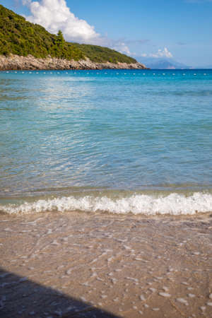 Trsteno beach in Montenegro, near Budva, in a beautiful bay with blue waterの写真素材