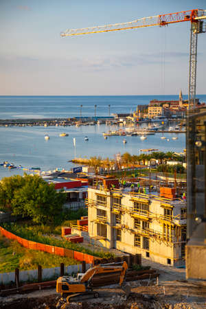 Budva, Montenegro - October 2, 2021: Budva building construction. Construction crane high-rise building in the center of Budva, Montenegroのeditorial素材