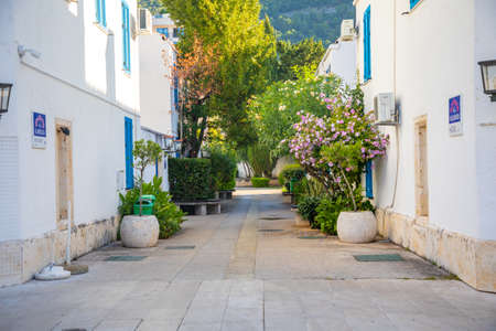Budva, Montenegro - September 26, 2021: Empty streets of hotel complex Slovenska Plaza with white architecture of villas at autumn sunny dayのeditorial素材