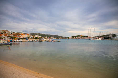 Rogoznica, Croatia - October 12, 2021: Coastline view at marble Rogoznica town scenery with sandy...