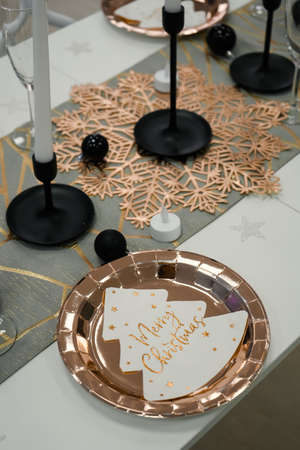 Christmas table setting with disposable plates and cupsの写真素材