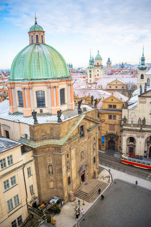 Prague, Czech Republic - December 26, 2021: Panorama of Prague Klementinum and roofs covered with snow in winter, Czech Republicのeditorial素材