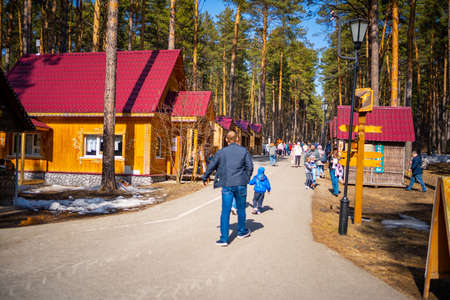 Kemerovo, Russia - April 16, 2022: People are walking in forest of open-air museum Tomsk pisanitsa located north-west of Kemerovo on the right bank of the Tom River in Siberia, Russia.のeditorial素材