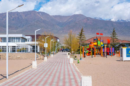Issyk-Kul, Kyrgyzstan - April 16, 2022: Beach of Issyk-Kul Lake in Kyrgyzstan in an spring sunny day.のeditorial素材