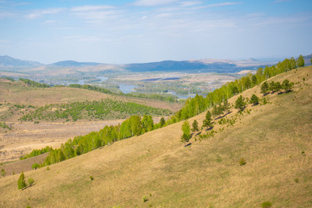 View with mountains, lake and valley from top of the rock - damn finger - in the mountainous Altai, Russiaの写真素材