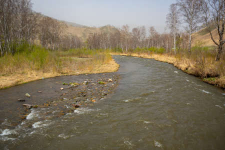 Turbid water of the Chuya river in the Altai Republic, Nature landscape with mountains, river and...