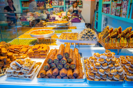Antalya, Turkey - September 10, 2022: The turkish sweets in street shop in old cities of Turkey.のeditorial素材