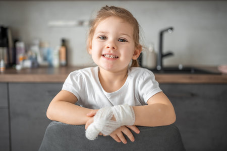 Little girl with broken finger at the doctors appointment in the hospital. High quality photoの写真素材