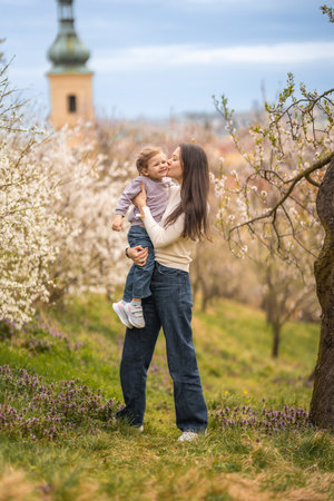 Young mother and her cute daughter having a fun in spring time park Petrin in Prague, Europe. High quality photoの写真素材