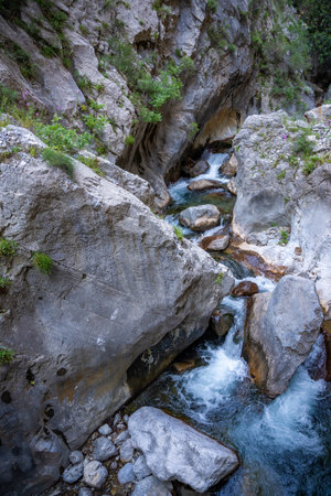 Fast flowing water in Sapadere canyon with rocks and stones in the Taurus mountains near Alanya, Turkey. High quality photoの写真素材