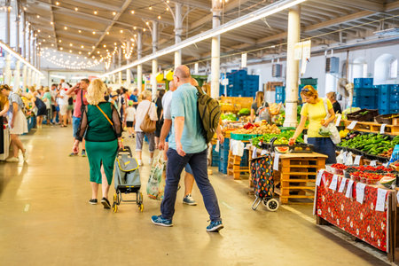 Prague, Czech Republic - August 19, 2023: People in main hall of Holesovice Market or Prazska...
