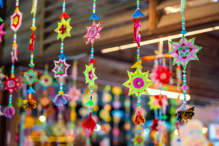 Handmade woven woollen circles hanging and blowing in the wind, Thailand. High quality photoの写真素材