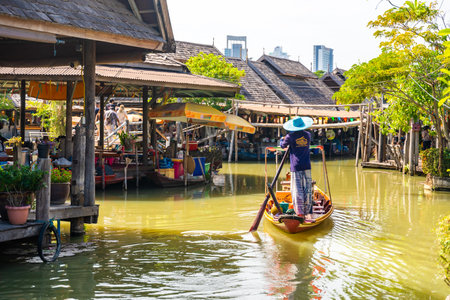 Pattaya, Thailand - December 29, 2023: Floating open air market with small houses - shops on the pond in Pattaya, Thailand. High quality photoのeditorial素材