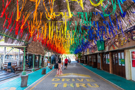 Pattaya, Thailand - December 29, 2023: Colorful ribbon fluttered in the windy day in floating open air market on the pond in Pattaya, Thailand. High quality photoのeditorial素材