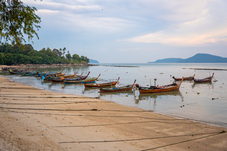 Rawai, Thailand - December 12, 2023: Fishing boats at Rawai beach after day work in Thailand. High quality photoのeditorial素材