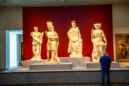 Abu Dhabi, UAE - December 6, 2023: Interior of Louvre and Visitors looking at exhibits, museum in Abu Dhabi, UAE. High quality photoのeditorial素材
