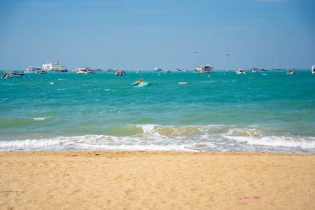 Pattaya, Thailand - December 26, 2023. Boats on turquoise water. North Pattaya beach in Thailand seaside. Pattaya, Thailand. . High quality photoのeditorial素材