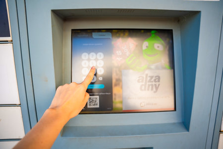 Prague,Czech republic - April 12, 2024: Self picking up goods from Alza Box. Parcel box logistics standing outside for customers, delivery box of Alza retail company e-shop in Prague, Czech republicのeditorial素材