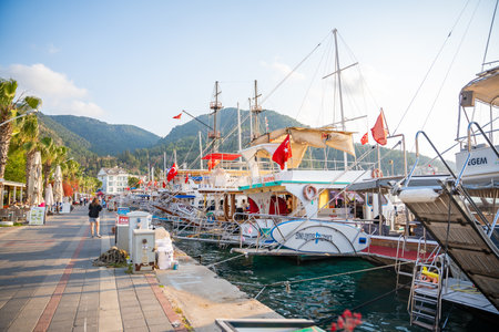 Fethiye, Turkey - May 11, 2024: Fethiye Marina in Turkey. A lot of excursion and private yachts in embankment of Marina. High quality photoのeditorial素材