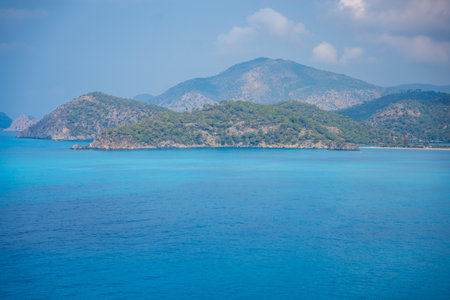 Aerial view of Oludeniz beach with people and boats in the morning, Coastline next to Fethiye,...