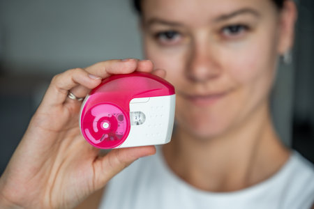 Close up of woman holding medicine dry powder inhaler for treatment asthma or COPD diseases....