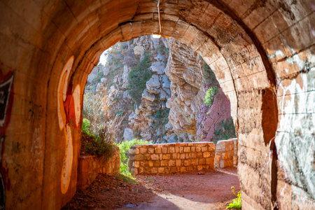 Pedestrian tunnel through a rock or mountain near Petrovac town in winter time, Montenegro. High...