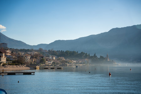 View of small village on coastline of Gulf of Kotor Bay next to Kotor town in Montenegro. High...