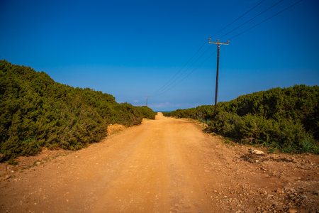 A winding road leading to the northeasternmost cape of Northern Cyprus. The image represents...