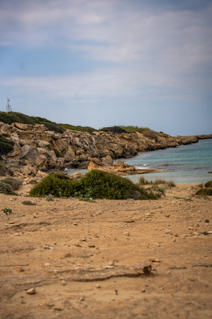 A wild, untouched beach on the northern coast of Cyprus, known as a nesting site for sea turtles. The image captures the pristine beauty of nature and the fragile ecosystem of marine wildlife.の写真素材