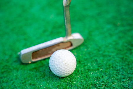 Mini-golf clubs and balls on artificial grass. Family vacations or resort. . High quality photoの写真素材