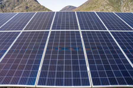 Close up of solar panels under bright sunlight with visible sun glare in Altai Russia Renewable...