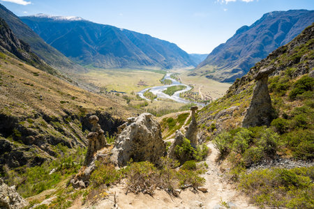View of Chulyshman valley and river through stone mushrooms in Altai Russia Unique natural landscape with rock formations and flowing water. High quality photoの写真素材