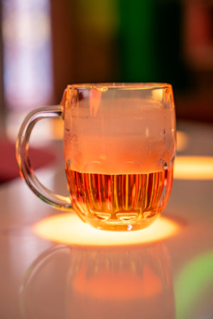 Prague, Czech republic - January 16, 2026: Beer mugs with Pilsner Urquell logo on bar counter during tasting at Beer Museum in Prague. Czech brewing tradition and beer culture tourism experienceのeditorial素材