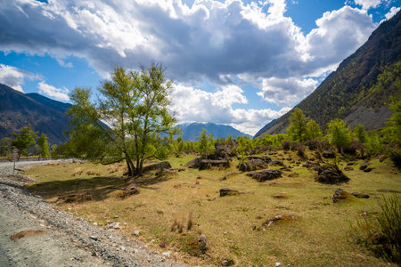 Chulyshman valley in Altai Russia with mountains and massive boulders scattered after earthquake...