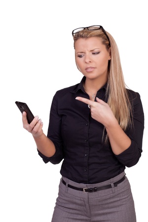 Angry business woman pointing on her smartphone - isolated on whiteの写真素材