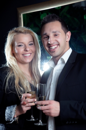 Evening portrait of a joyful romantic young couple with beaming smilesの写真素材
