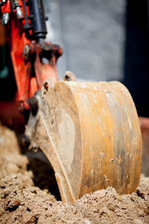 Heavy plant machinery front loaded digger excavating sandの写真素材