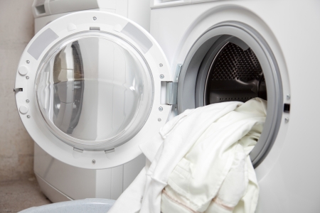 Some dirty clothes in the washing machine の写真素材