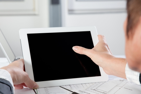 A gesture on a Tablet PC with one Finger in a hotizontal position.の写真素材