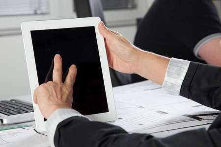 A gesture on a Tablet PC with two Fingers in a vertical position.の写真素材