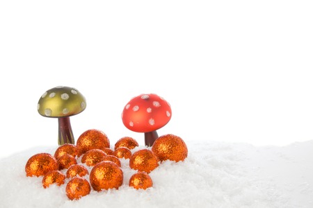 Two Mushrooms on a snowy Ground with some xmas balls の写真素材