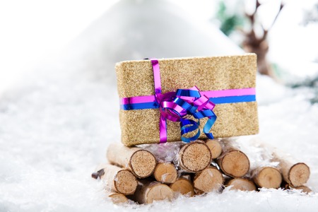 A nature Christmas Gift stand within a snowy winter landscape の写真素材