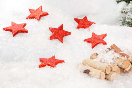 Some XMas Stars a lying in a snowy landscape 