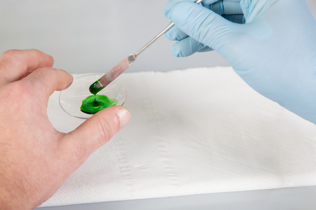 A Chemistis testing the surface energy from a green Substance の写真素材