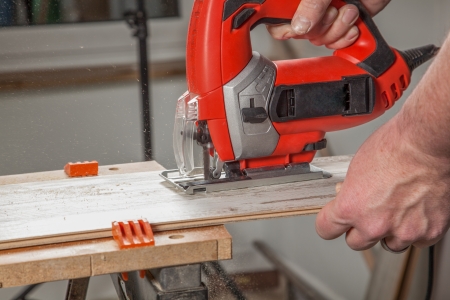 A Craftsman is sawing a sawing a Laminate panel の写真素材