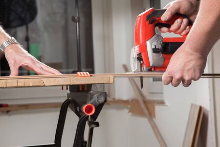 Two Carpenters are working with a jig saw の写真素材
